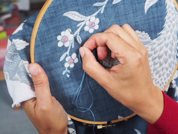 embroidering over printed fabric